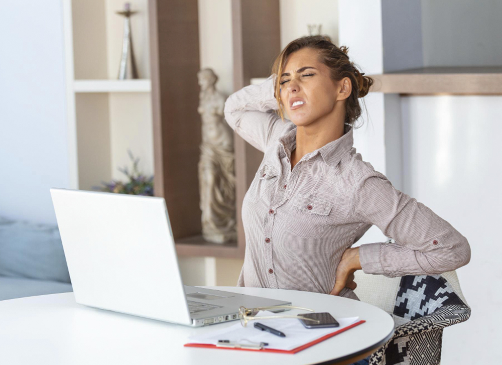 Prolonged sitting causing spine strain